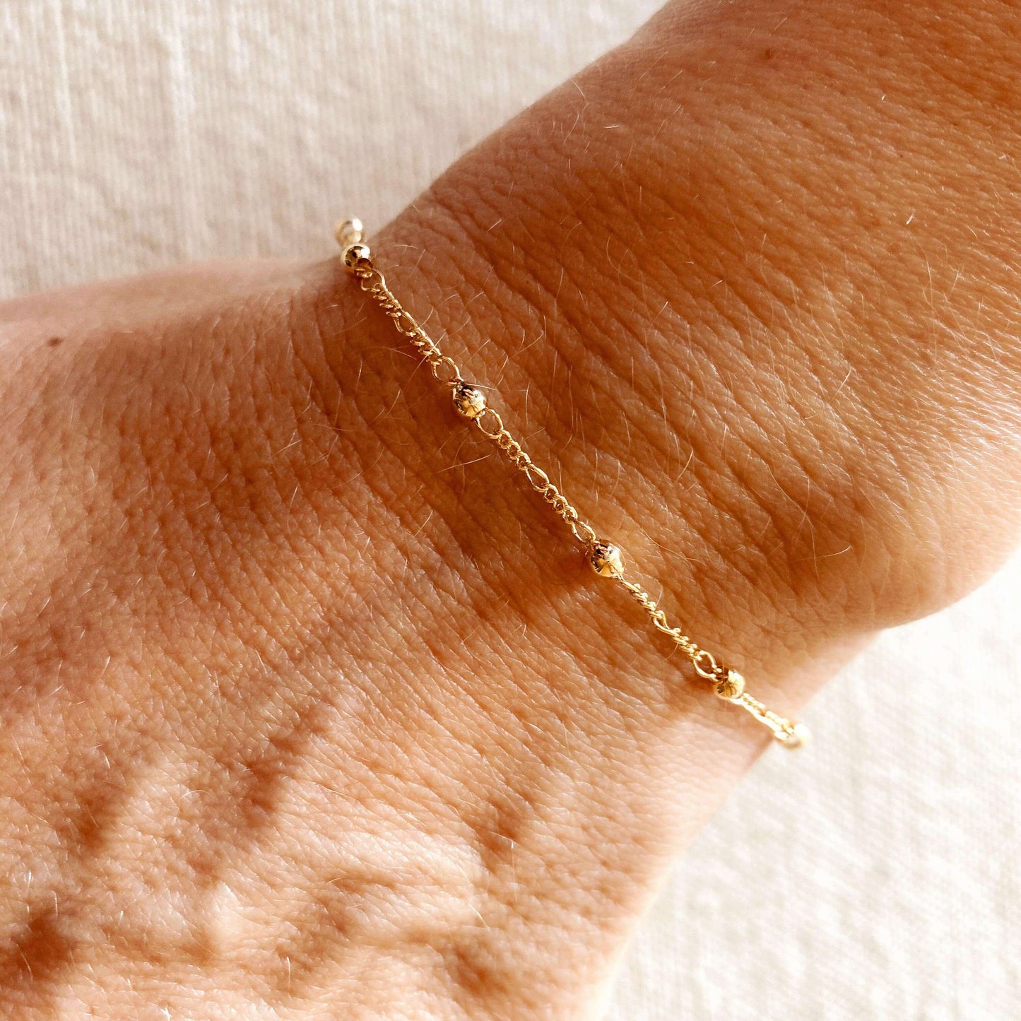 Beaded Gold Bracelet with Cross Charm